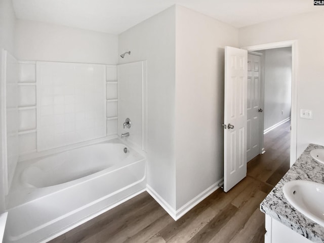 6 Sawdust Ct, Columbia, SC 29209 - bathroom featuring double vanity, a sink, washtub / shower combination, and wood finished floors