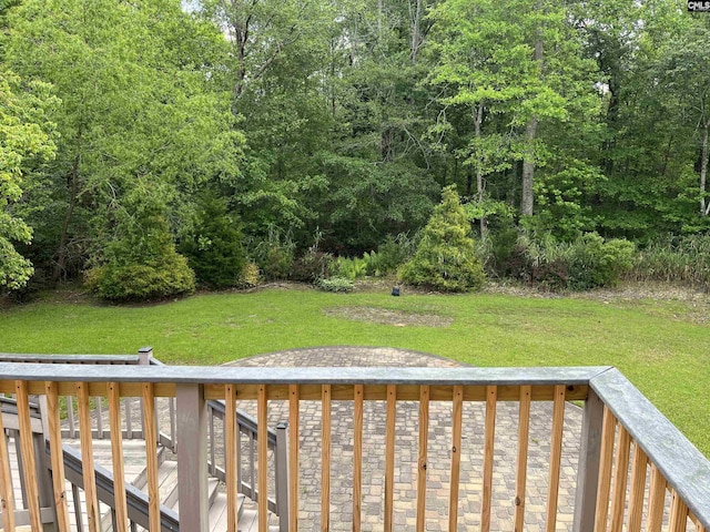 deck featuring a lawn