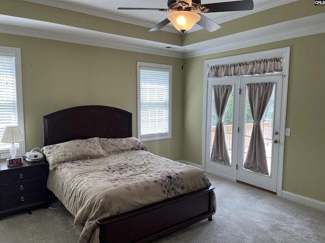 bedroom with crown molding, access to outside, light colored carpet, and multiple windows