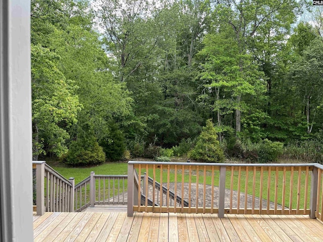 deck featuring a lawn