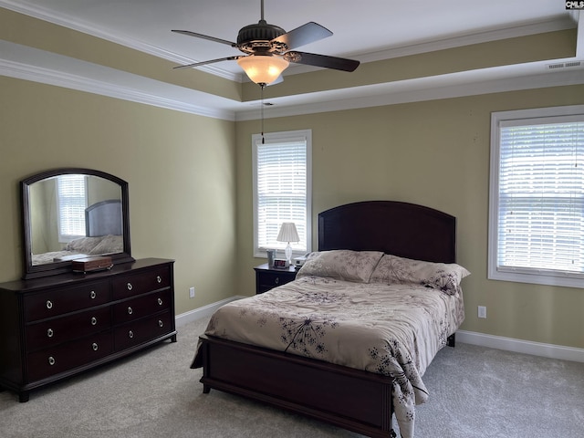 bedroom featuring light colored carpet, multiple windows, and visible vents
