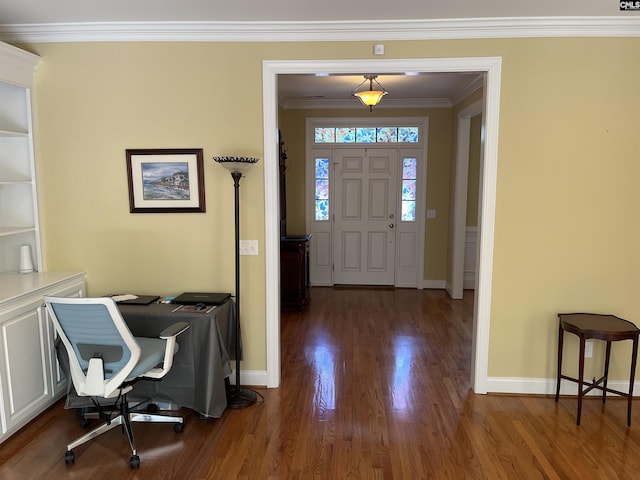 entryway featuring baseboards, ornamental molding, and wood finished floors