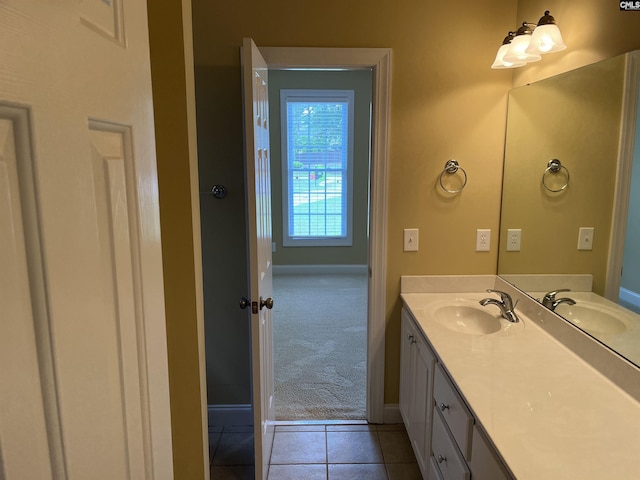 bathroom featuring baseboards and a sink
