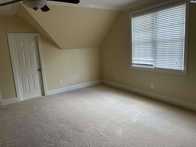 bonus room with ceiling fan, vaulted ceiling, baseboards, and carpet