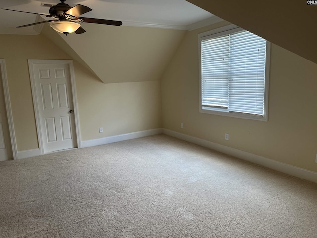bonus room featuring baseboards, carpet flooring, ceiling fan, and vaulted ceiling