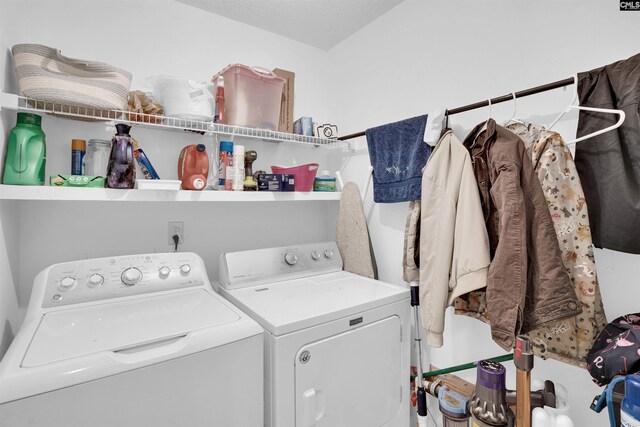 washroom with laundry area and washer and dryer