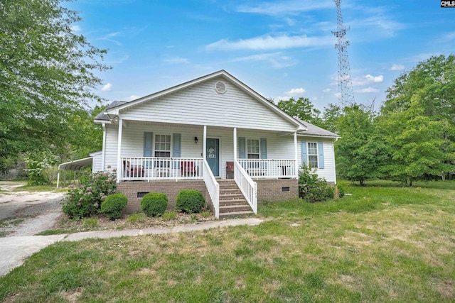 bungalow with a front yard, a porch, driveway, stairway, and a carport