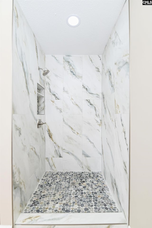 bathroom with recessed lighting and a stall shower