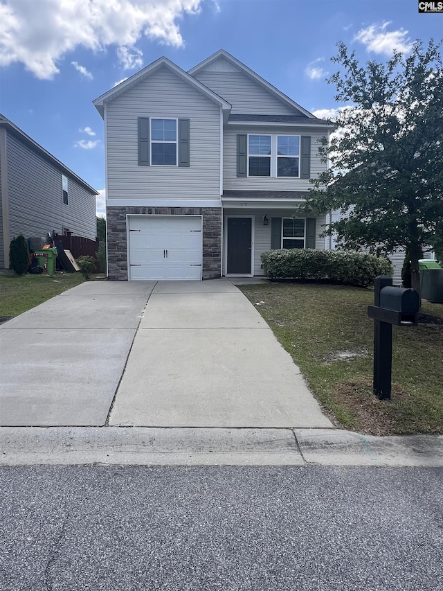 view of front of property featuring an attached garage, a front yard, stone siding, and concrete driveway