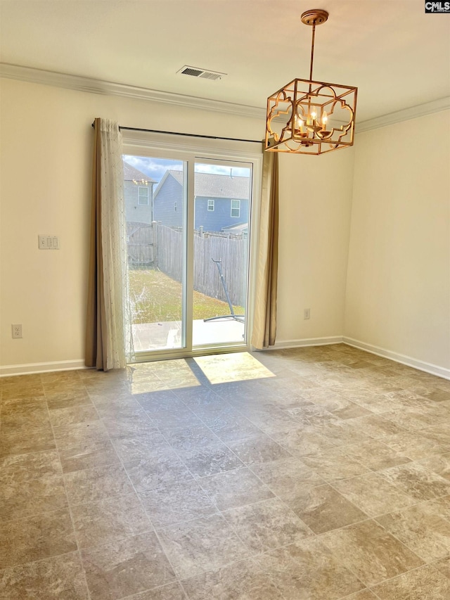 spare room with baseboards, ornamental molding, visible vents, and a chandelier