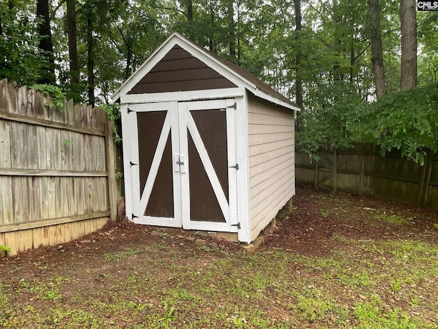 view of shed featuring a fenced backyard