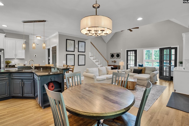 dining area with stairs, recessed lighting, and light wood-type flooring