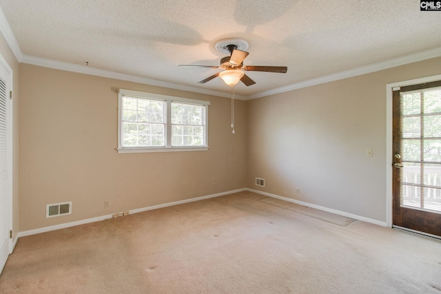 empty room with ceiling fan, a wealth of natural light, and light carpet
