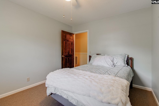 carpeted bedroom with baseboards, ceiling fan, and visible vents