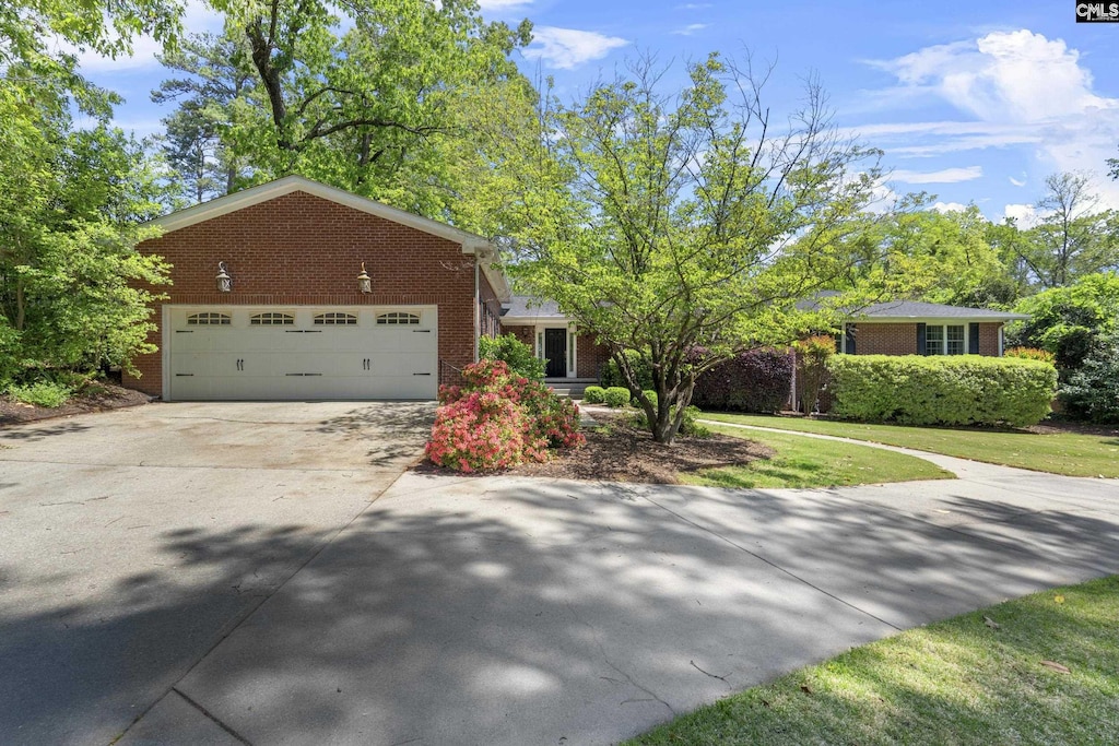 5904 Lakeshore Dr, Columbia, SC 29206 - ranch-style house featuring brick siding, driveway, and an attached garage