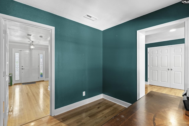 5904 Lakeshore Dr, Columbia, SC 29206 - spare room featuring wood-type flooring, baseboards, visible vents, and ornamental molding