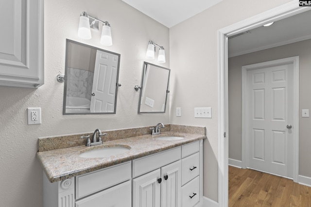 5904 Lakeshore Dr, Columbia, SC 29206 - bathroom with double vanity, a sink, baseboards, and wood finished floors