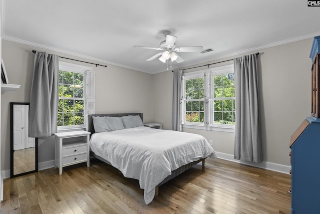 5904 Lakeshore Dr, Columbia, SC 29206 - bedroom with a ceiling fan, baseboards, ornamental molding, and hardwood / wood-style flooring