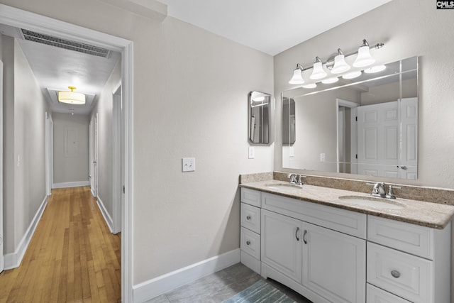 5904 Lakeshore Dr, Columbia, SC 29206 - bathroom with a sink, baseboards, double vanity, and visible vents