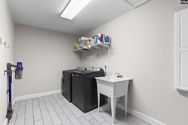 5904 Lakeshore Dr, Columbia, SC 29206 - washroom with laundry area, baseboards, wood finish floors, and washer and dryer