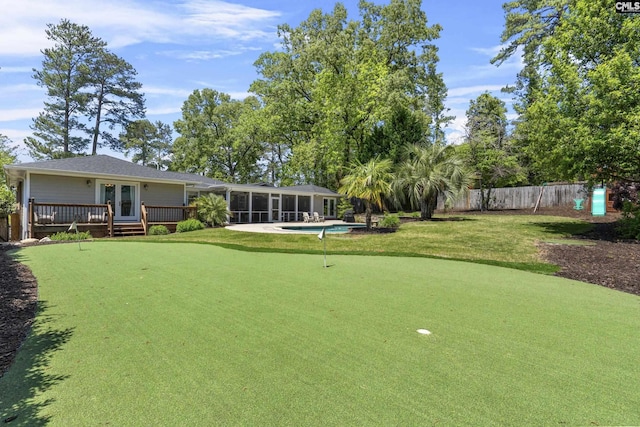 5904 Lakeshore Dr, Columbia, SC 29206 - view of yard with a wooden deck, fence, french doors, a sunroom, and a fenced in pool