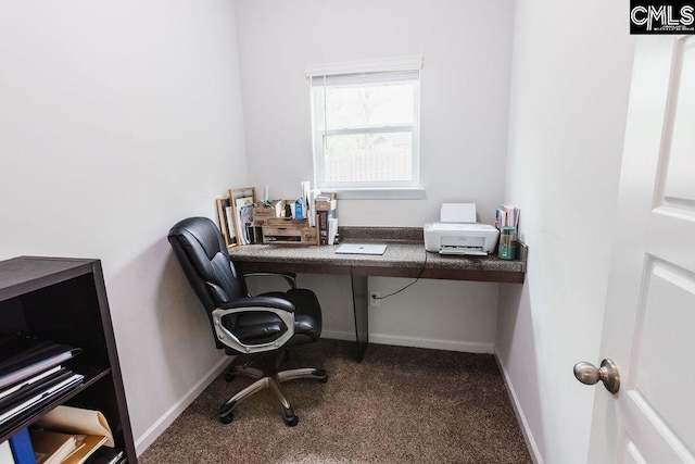 carpeted home office featuring baseboards