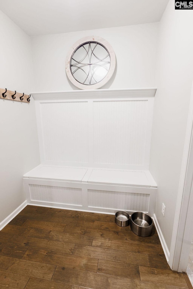 mudroom featuring wood-type flooring and baseboards