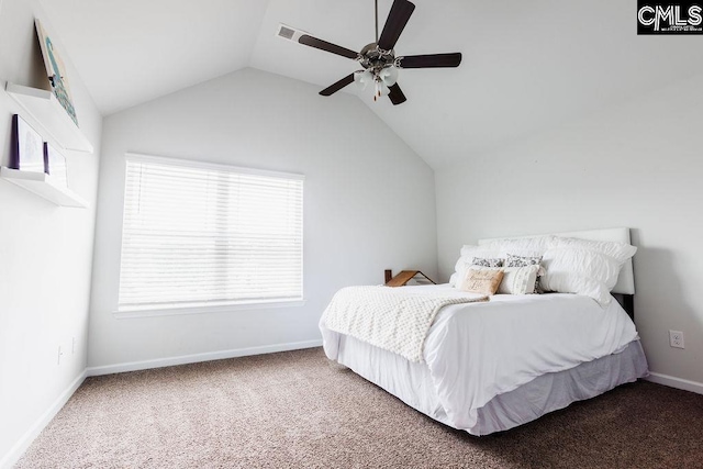 carpeted bedroom featuring baseboards, ceiling fan, vaulted ceiling, and multiple windows