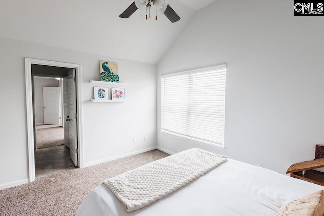 carpeted bedroom featuring baseboards, ceiling fan, and vaulted ceiling