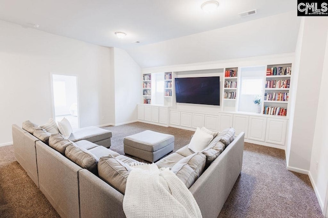 carpeted living area featuring baseboards, visible vents, built in shelves, and lofted ceiling