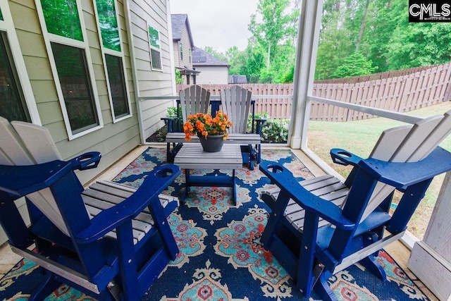 view of patio / terrace featuring fence