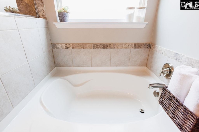full bathroom with a garden tub