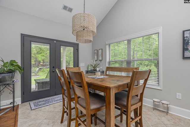 dining area featuring a notable chandelier, visible vents, a healthy amount of sunlight, and french doors