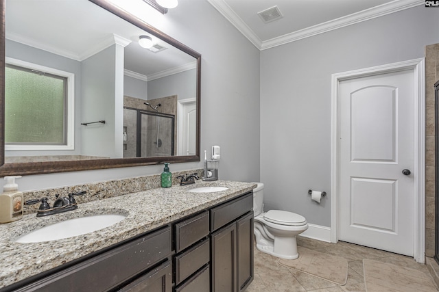 bathroom featuring a sink, a stall shower, toilet, and visible vents