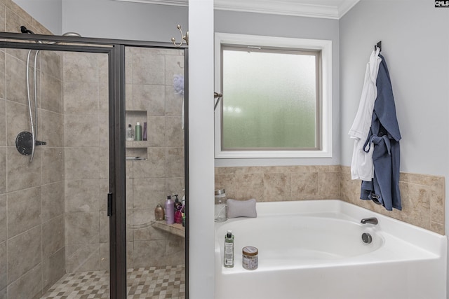 bathroom with a garden tub, ornamental molding, and a stall shower