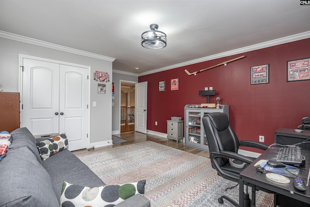 office area with baseboards, ornamental molding, and wood finished floors
