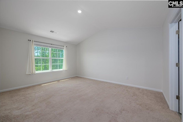 carpeted empty room with recessed lighting, baseboards, vaulted ceiling, and visible vents
