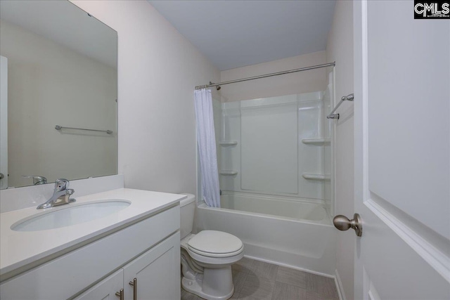bathroom featuring toilet, shower / bath combination with curtain, and vanity