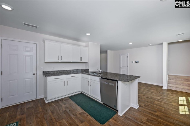 kitchen with visible vents, white cabinets, dark wood-style floors, and dishwasher