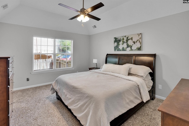 carpeted bedroom featuring baseboards, a ceiling fan, vaulted ceiling, and visible vents
