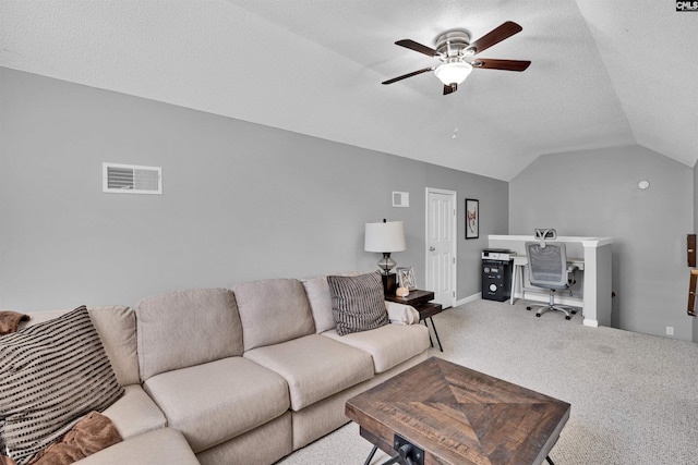 living area with ceiling fan, visible vents, vaulted ceiling, baseboards, and carpet flooring