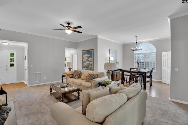 living area with visible vents, light carpet, and plenty of natural light