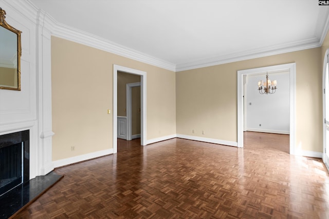unfurnished living room with baseboards, ornamental molding, and a notable chandelier