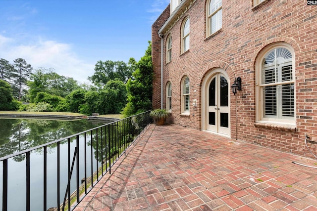 view of patio / terrace with a balcony and french doors