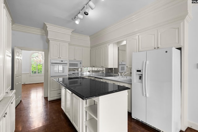 kitchen featuring white appliances, white cabinetry, open shelves, and a kitchen island