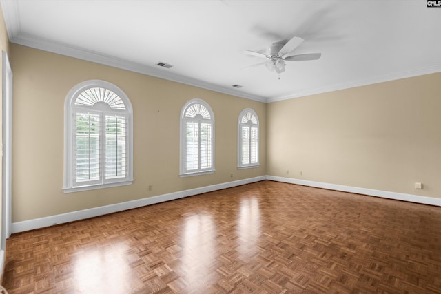 empty room featuring baseboards, plenty of natural light, and visible vents