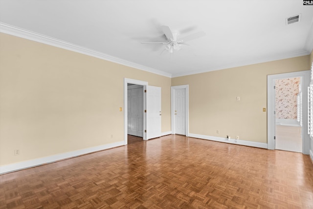 spare room featuring visible vents, a ceiling fan, baseboards, and ornamental molding