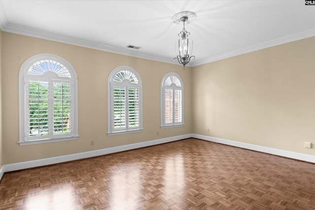 unfurnished room with visible vents, baseboards, crown molding, and a notable chandelier