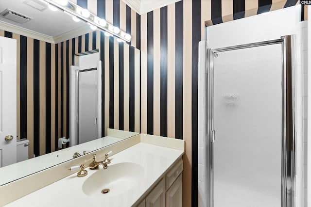 full bathroom featuring visible vents, vanity, a stall shower, and wallpapered walls
