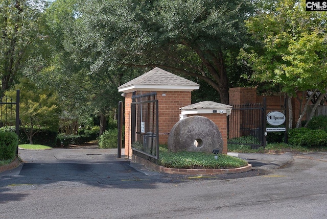 exterior space with fence and a gate